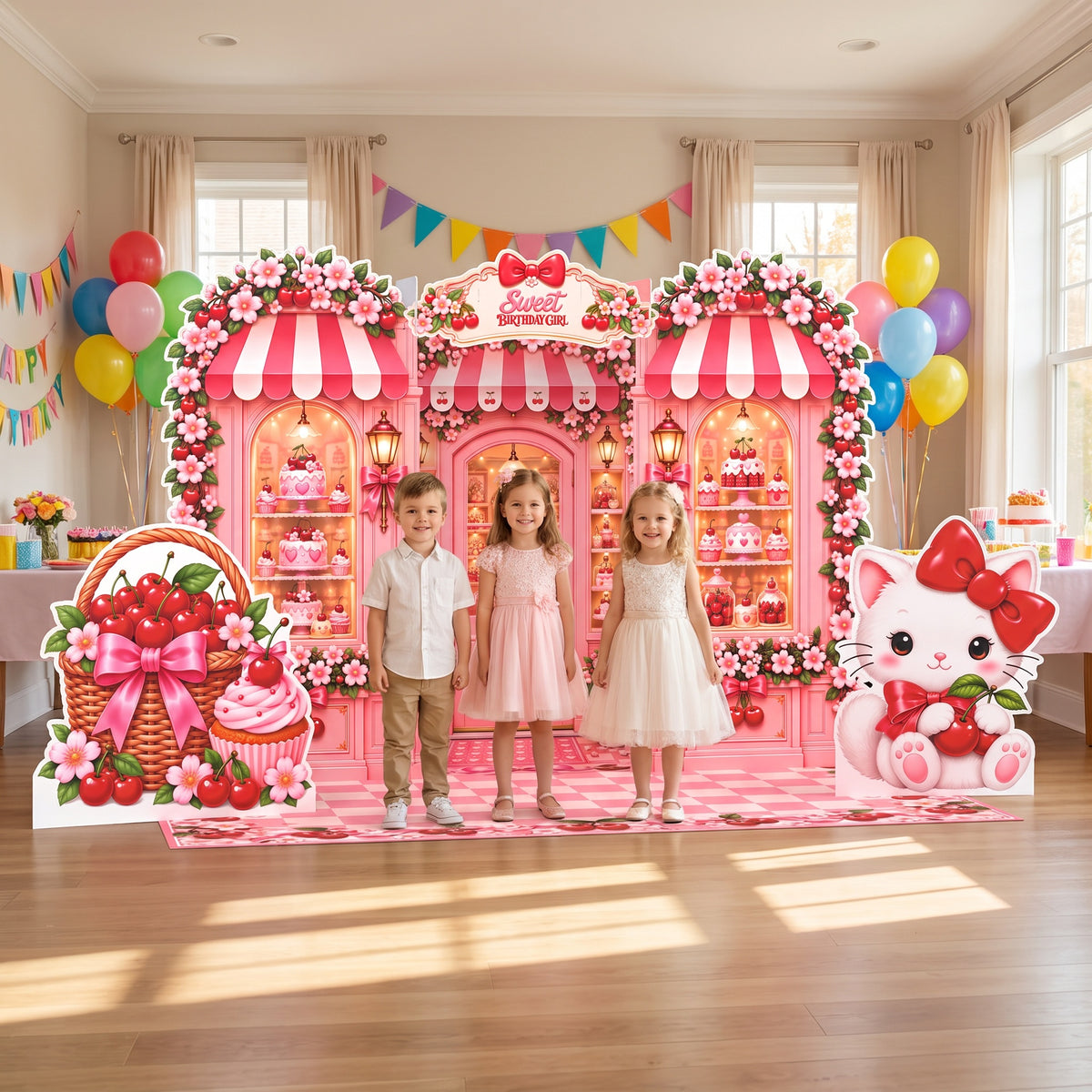 Kids at a cherry birthday party in front of the FoldWow Cherry Shop backdrop