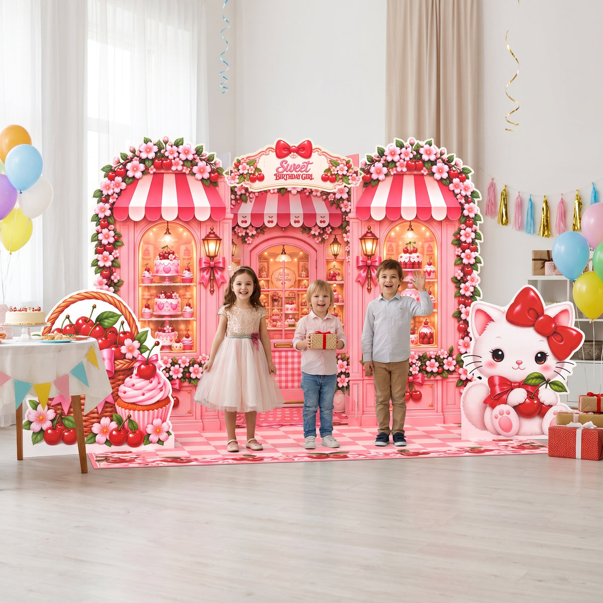 Kids posing at a cherry birthday party with the FoldWow Cherry Shop backdrop and cutouts