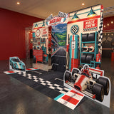 FoldWow race car party backdrop with open-wheel race car cutout and checkered starting line