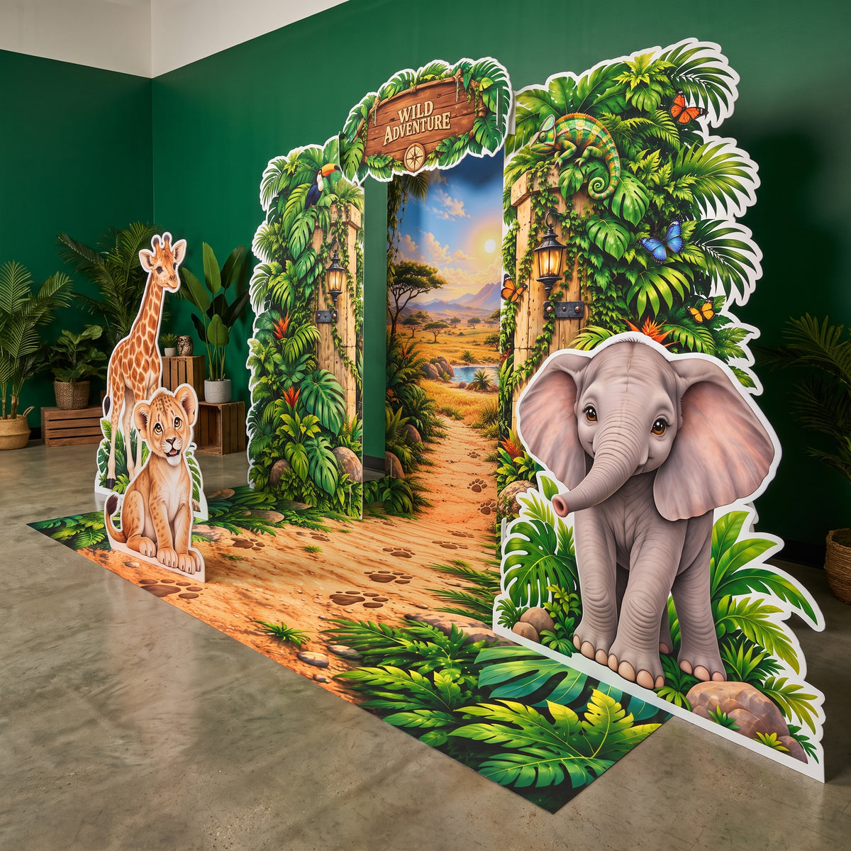 FoldWow Wild Adventure jungle gate backdrop with safari animal cutouts in a green party room
