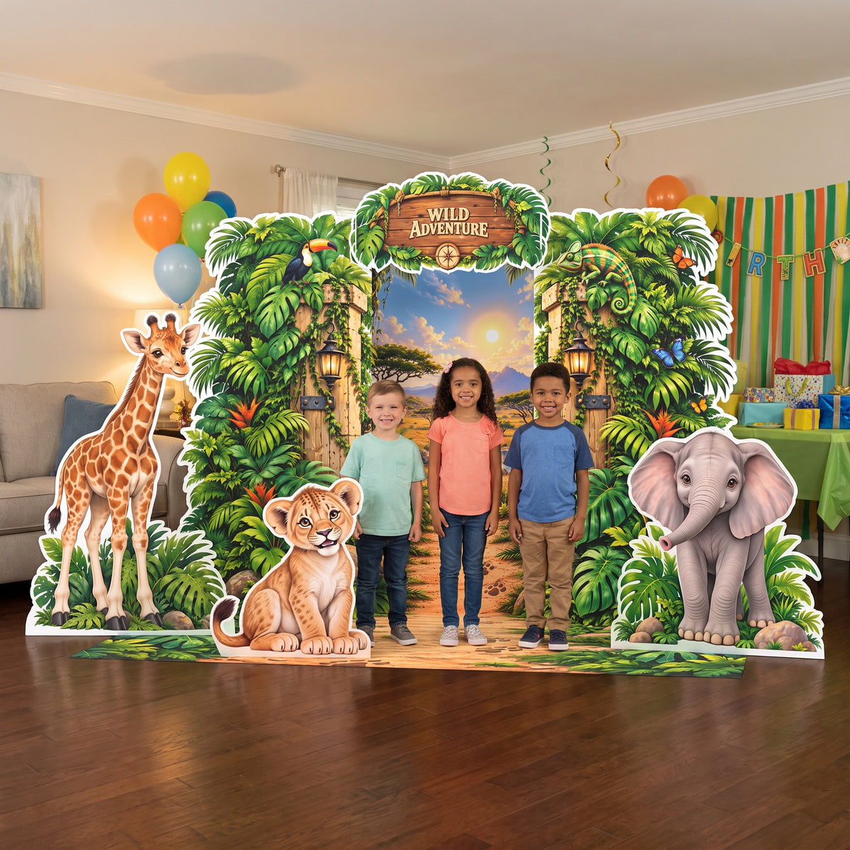 Kids posing in front of the FoldWow Wild Adventure safari party backdrop