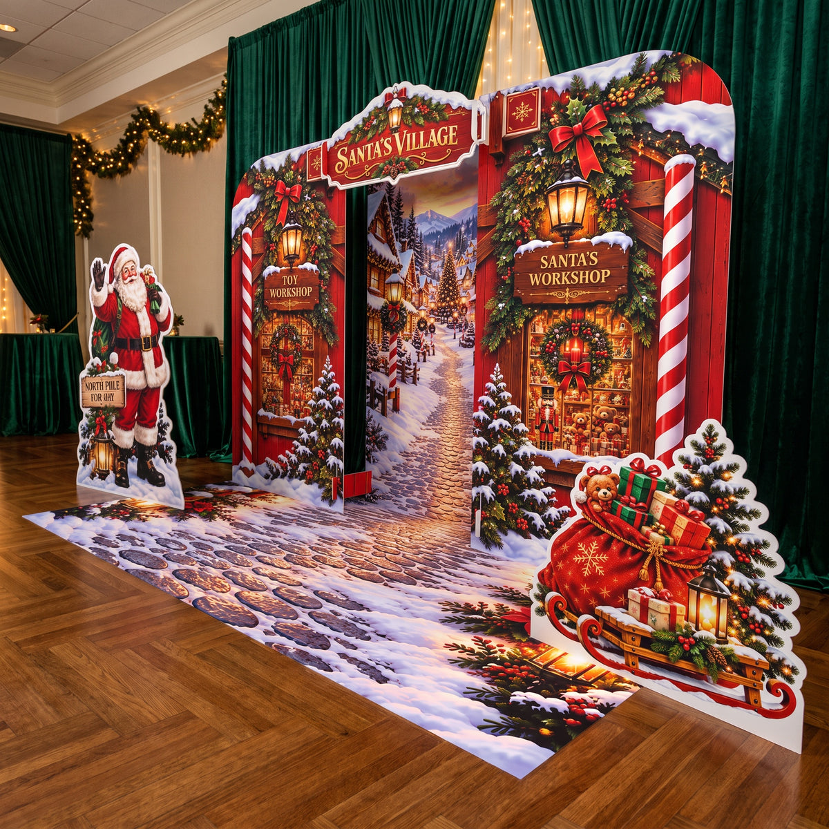 FoldWow Santa's Village Christmas backdrop with workshops, Santa cutout and snowy cobblestone banner